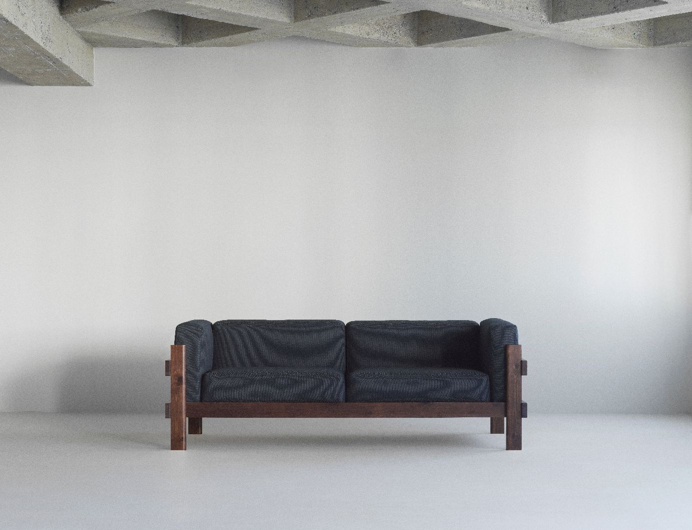 Kube Sofa von Normann Copenhagen mit dunklem Stoffbezug und Holzrahmen in minimalistischem Interieur.