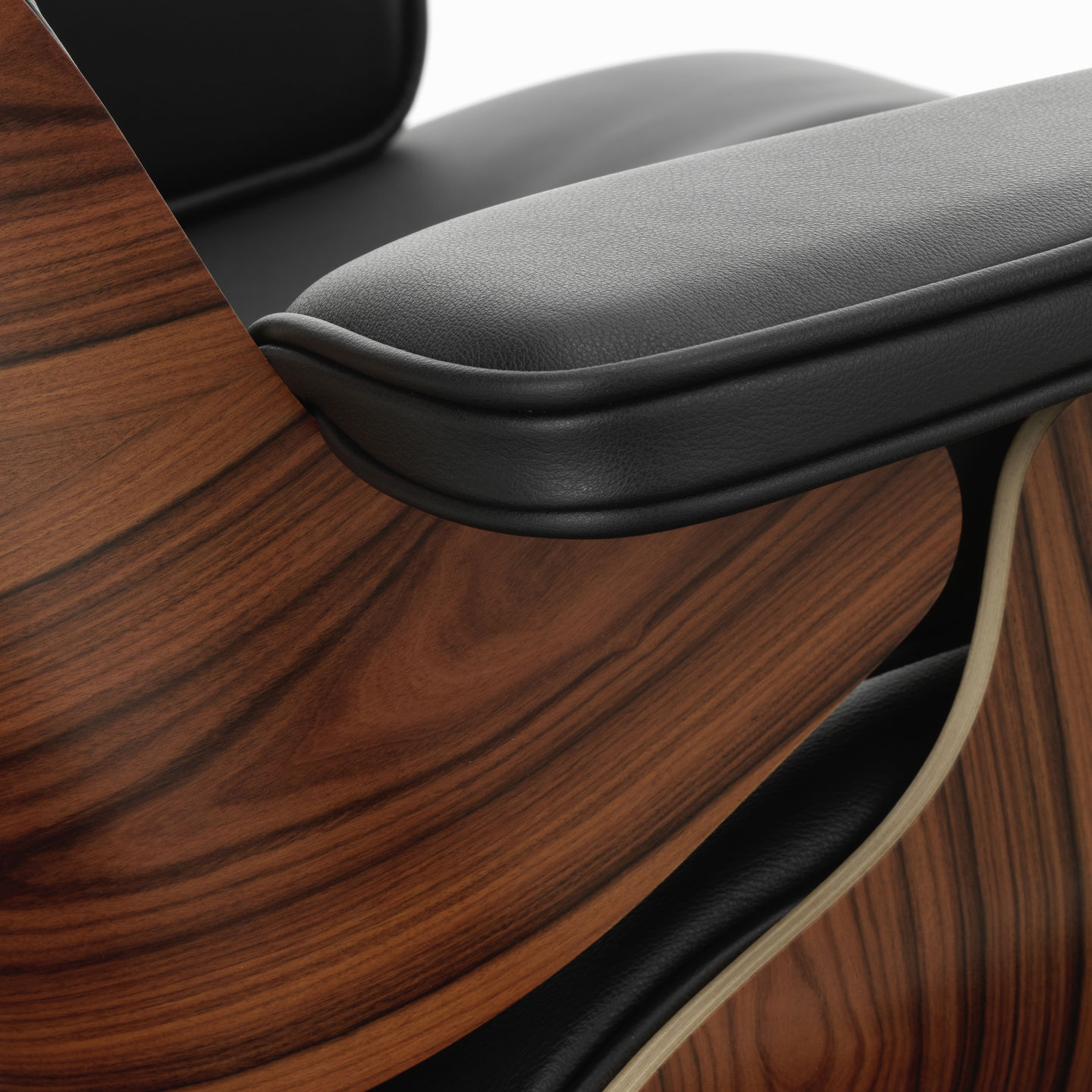 Detailaufnahme von Armlehne und Holzstruktur des Eames Lounge Chair von Vitra im Konfigurator.