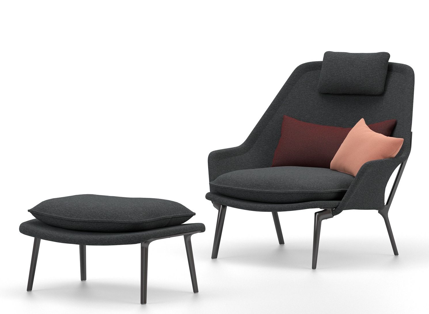 Grauer Vitra Slow Chair Sessel mit Ottoman und Kissen für entspanntes Wohnen.
