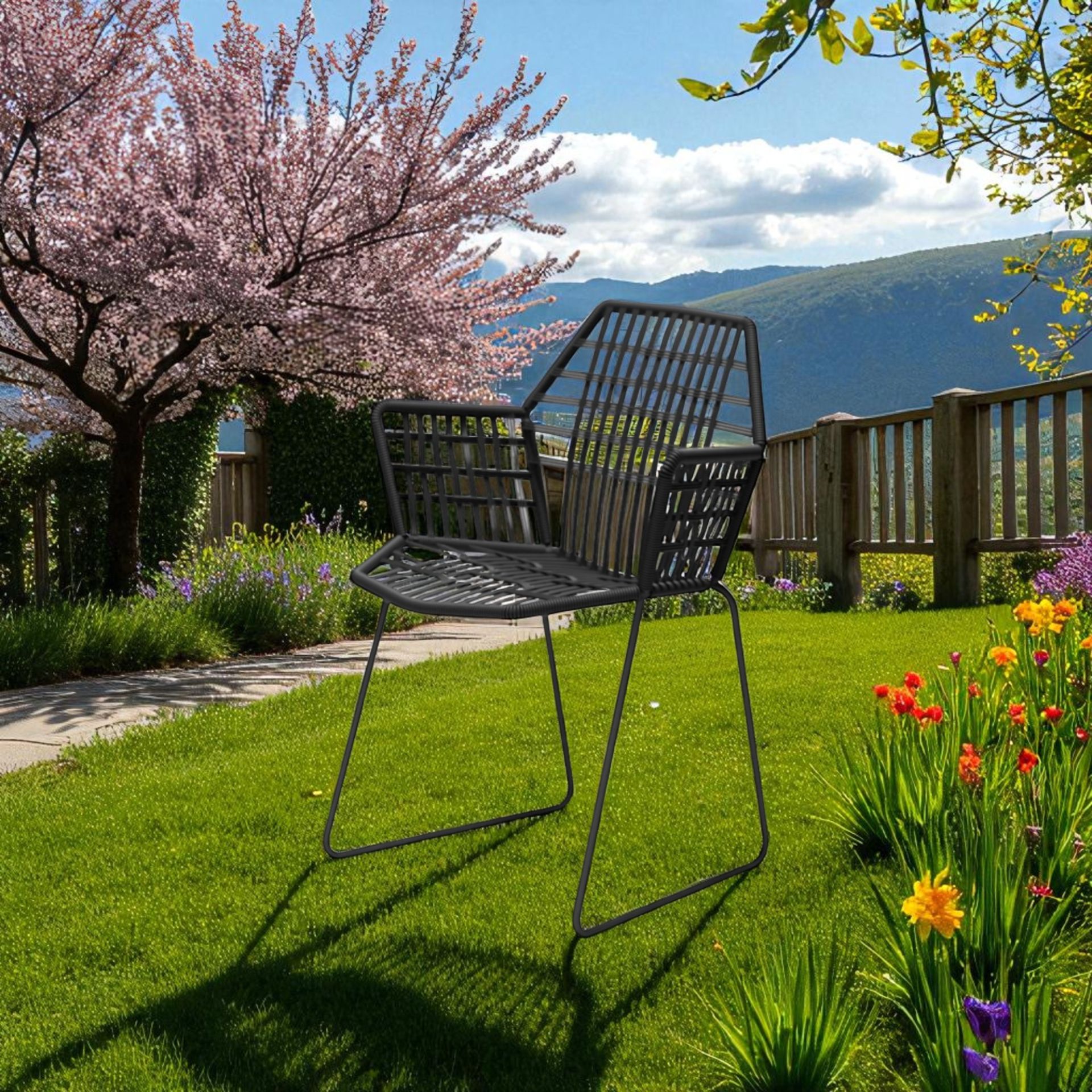 Tropicalia TR1 Armchair Outdoor Armlehnenstuhl von Moroso im Garten, mit Blumen und blühendem Baum.