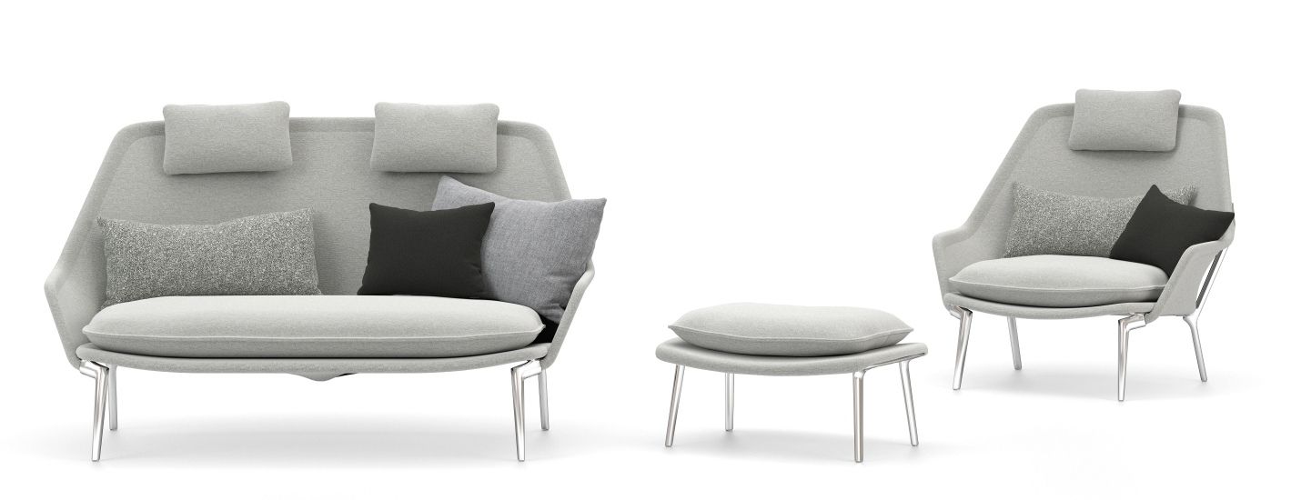 Vitra Slow Chair Sessel mit Ottoman in grauem Stoffbezug und Kissen, modernes Wohnzimmer Design.