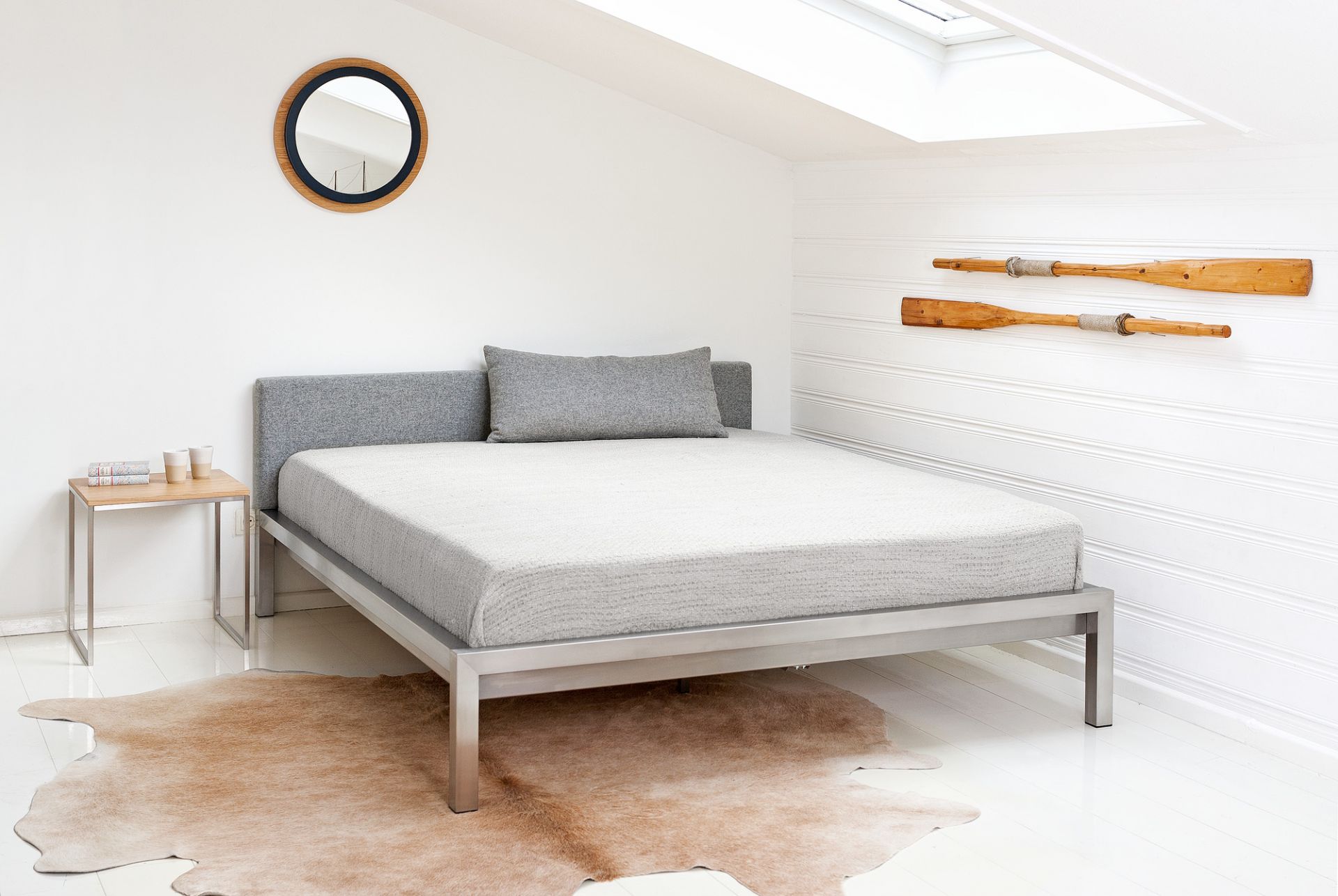 Pure stainless steel bed with upholstered headboard imitation leather black Hans Hansen