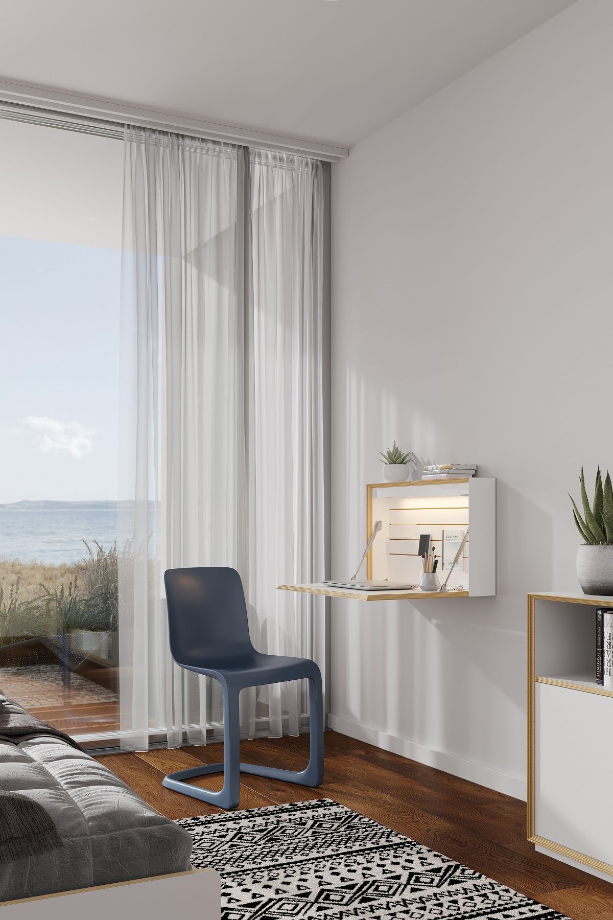 Modernes Wohnzimmer mit Flatbox Sekretär von Müller Möbelwerkstätten, geöffnet und mit Laptop, Stuhl und Meerblick.