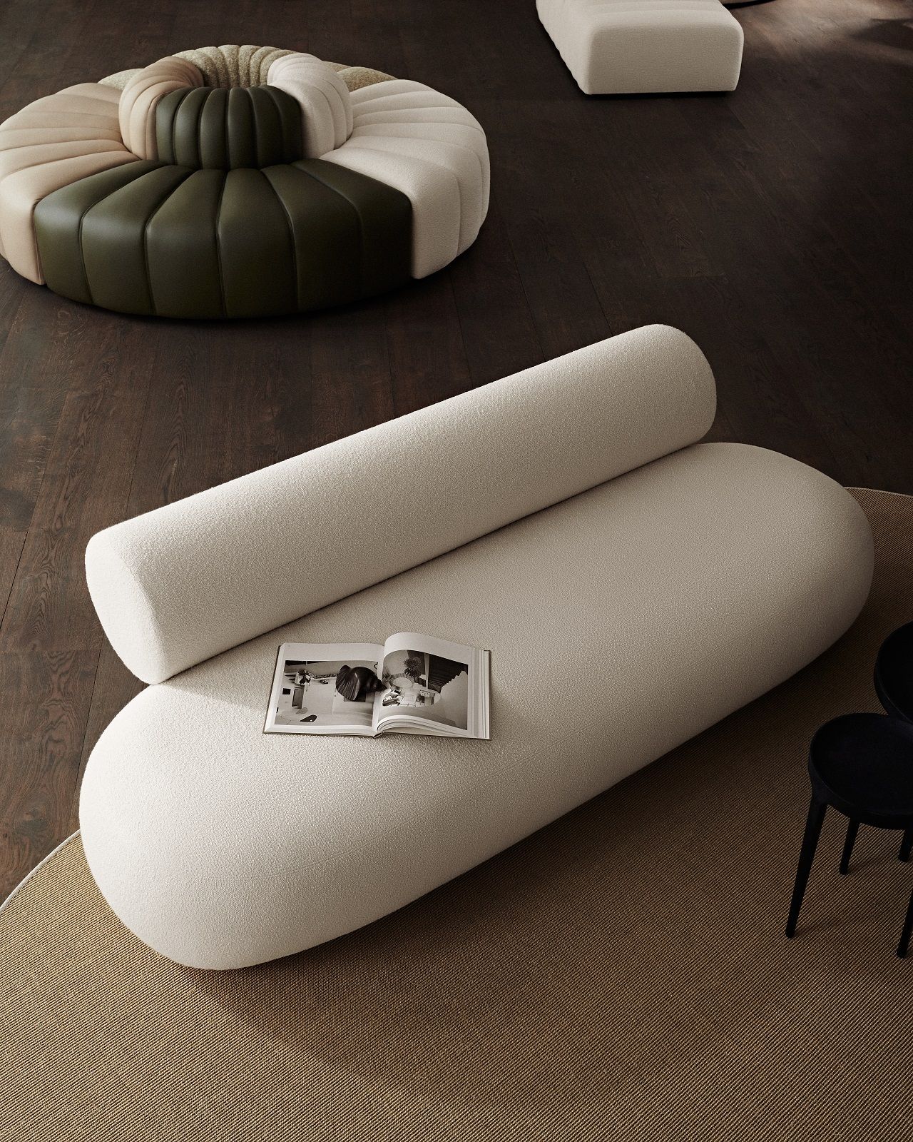 Beige Hippo Sofa von Norr11 aus Holz mit runden Kissen und offenem Buch im Wohnzimmer.